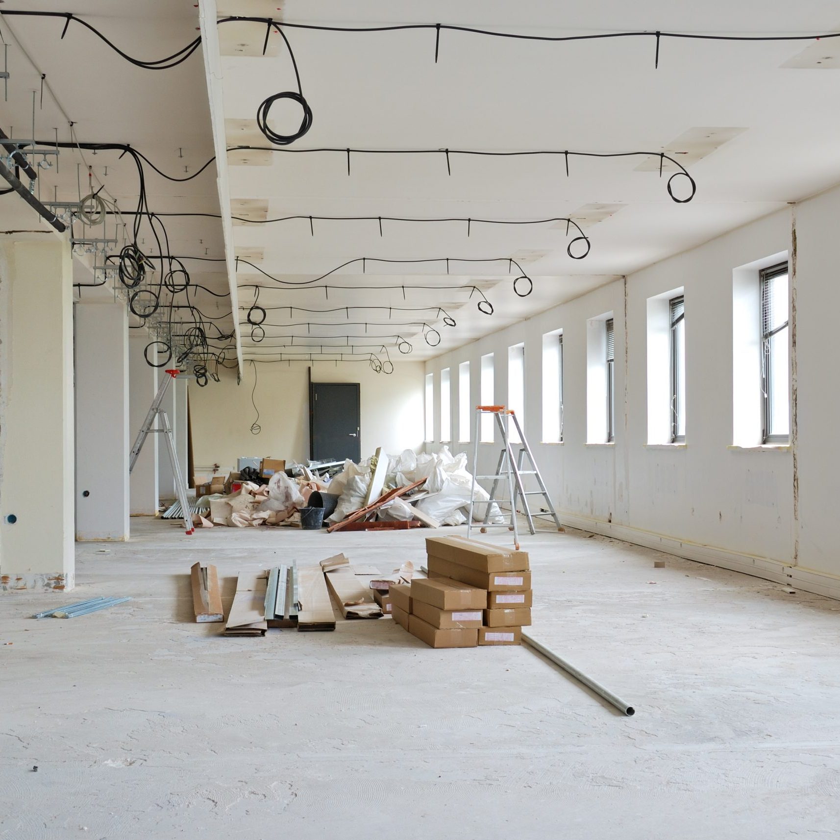 Improvement construction work in huge white office.